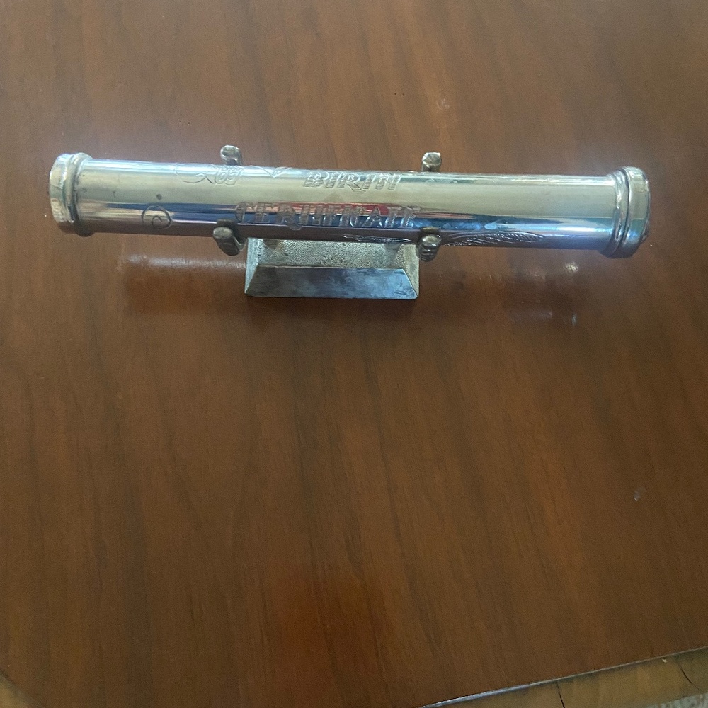 Silver birth certificate holder